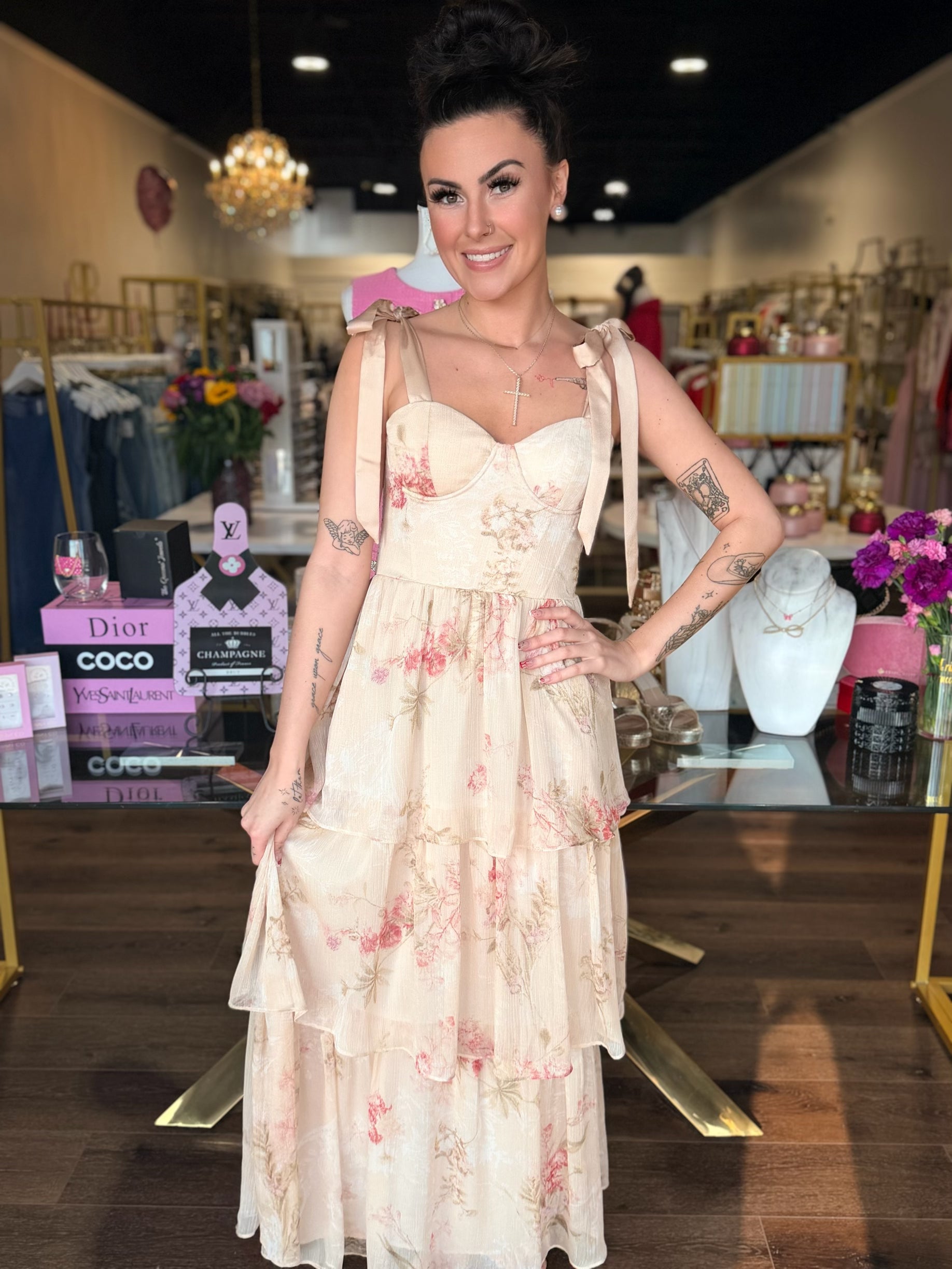 Model wearing cream midi dress with pink florals 