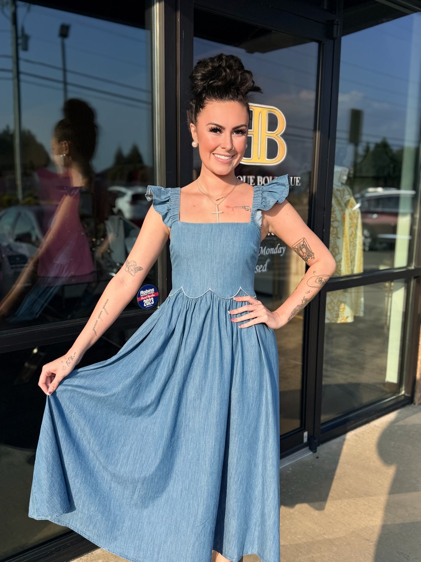 Model wearing denim midi dress