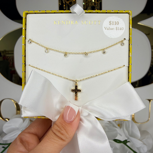 Hand holding cross Kendra Scott gift set 