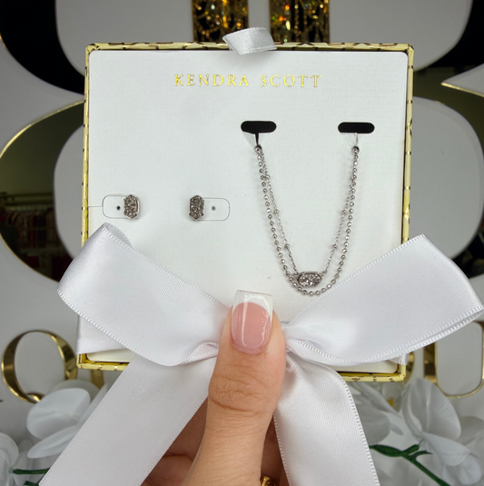 Hand holding silver pendant Kendra Scott gift set 