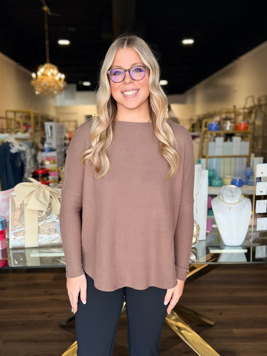 model wearing brown long sleeve top