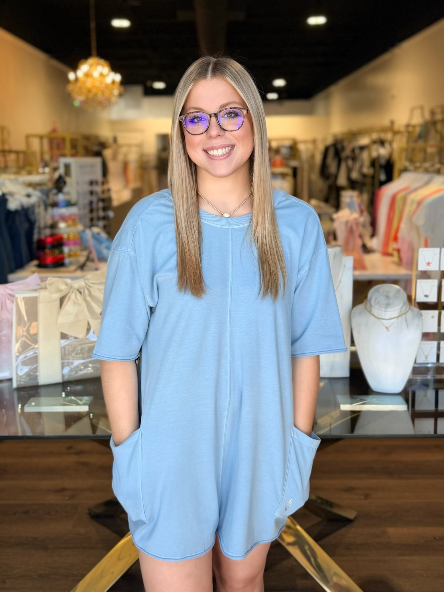model wearing blue romper