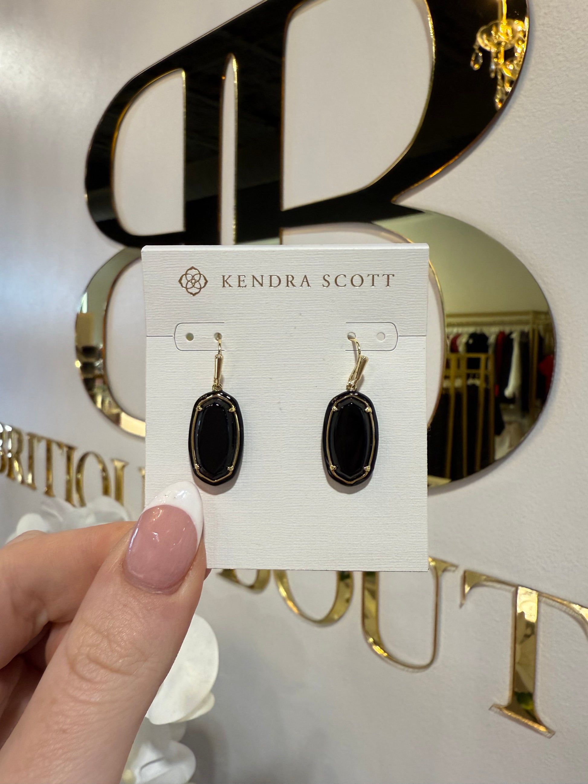 BOUTIQUE KENDRA SCOTT DANI GOLD ENAMEL FRAMED DROP EARRINGS BLACK AGATE IN HAND