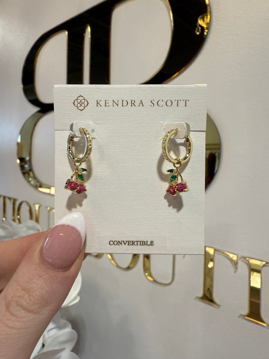 BOUTIQUE  KENDRA SCOTT GOLD CHERRY HUGGIE IN BERRY KYOCERA OPAL IN HAND