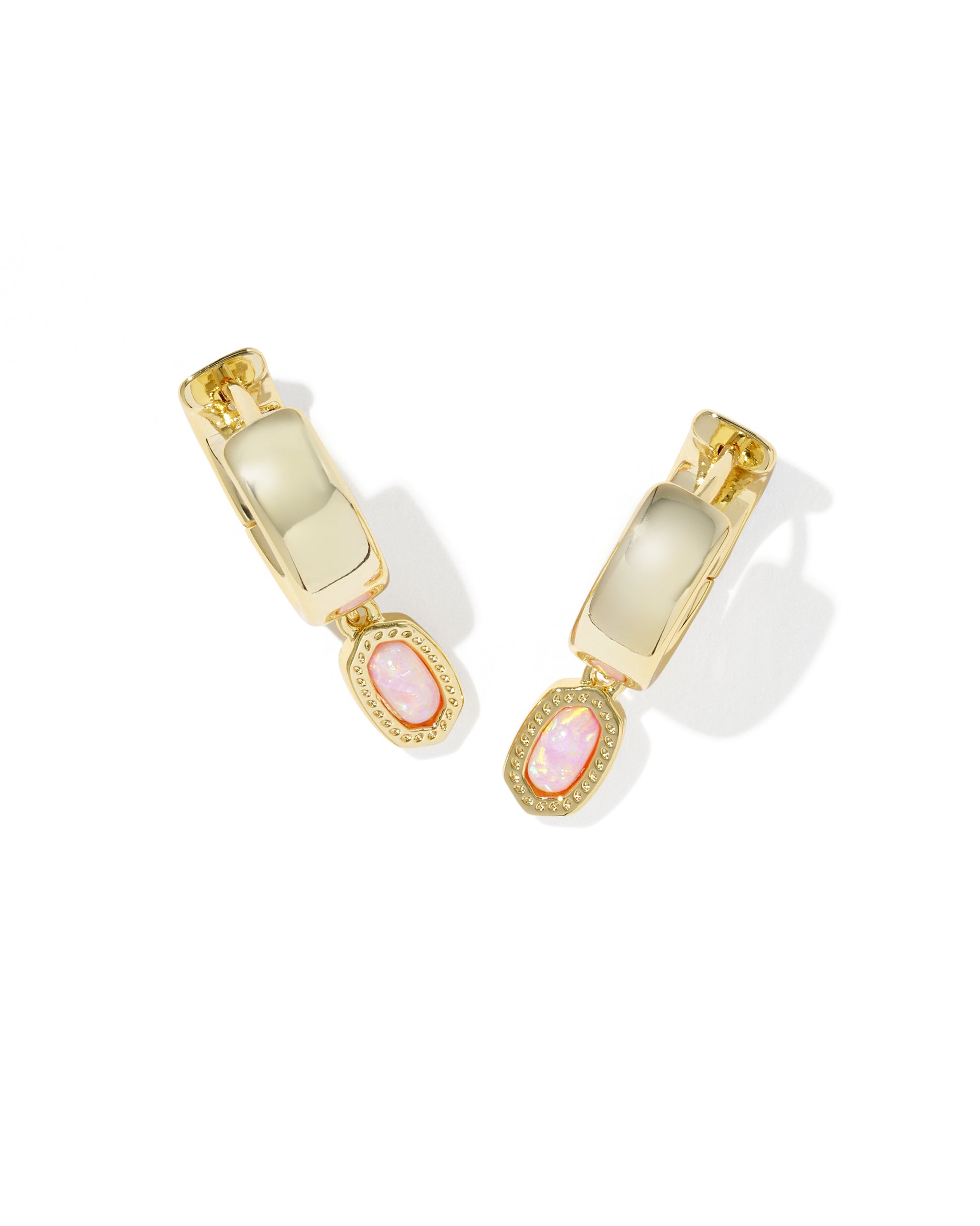 Gold Kendra Scott hoop earrings with pink gemstones on a white background