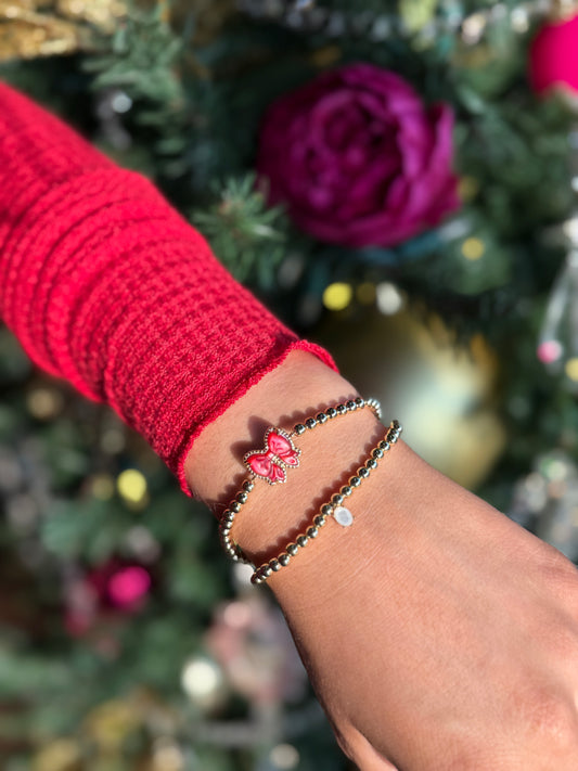 BOUTIQUE KENDRA SCOTT HALEY BOW STRETCH BRACELET GOLD SCARLET RED MOTHER OF PEARL ON WRIST