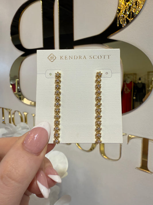 BOUTIQUE KENDRA SCOTT NYDIA LINEAR GOLD EARRINGS IN WHITE CRYSTAL IN HAND