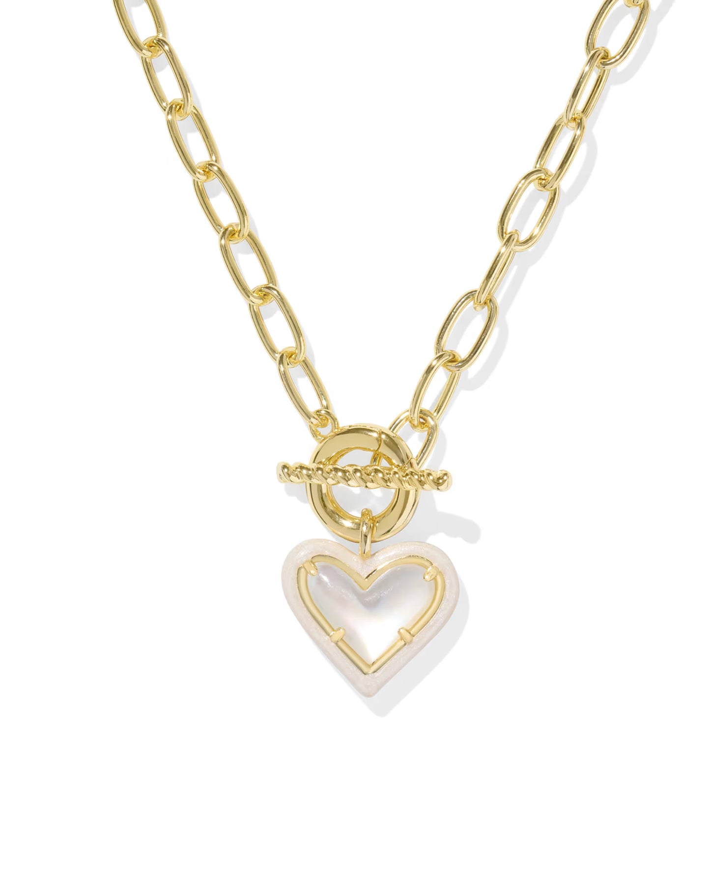 Gold Kendra Scott chain necklace with a heart-shaped pendant on a white background