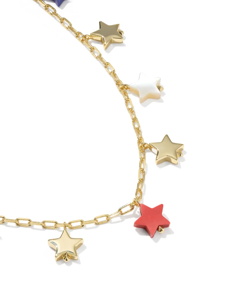 Gold chain necklace with colorful star pendants on a white background