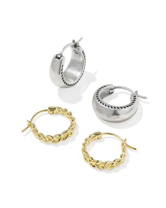 Set of silver and gold hoop earrings on a white background