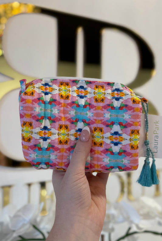 BOUTIQUE LAURA PARK SUMNER PINK SMALL COSMETIC BAG IN HAND