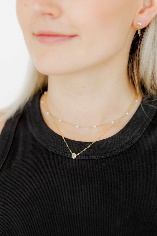 BOUTIQUE LINNY CO PALOMA PEAR DROP GOLD NECKLACE ON NECK