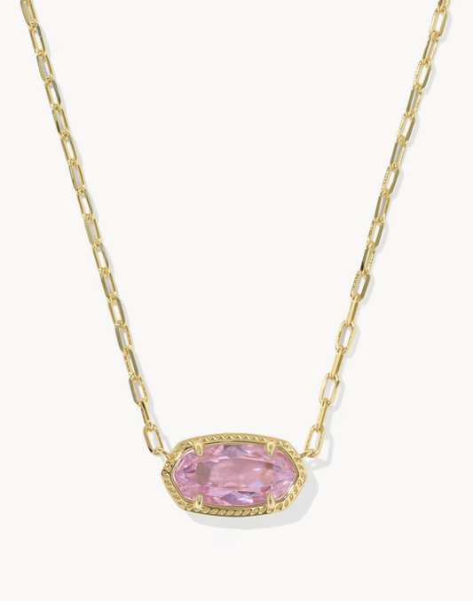 Necklace with a pink gemstone and gold chain on a white background