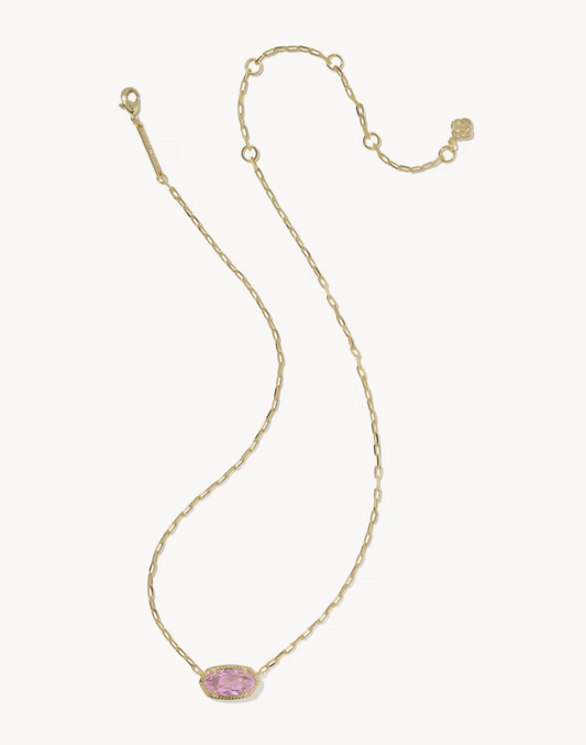 Gold necklace with a pink gemstone on a white background