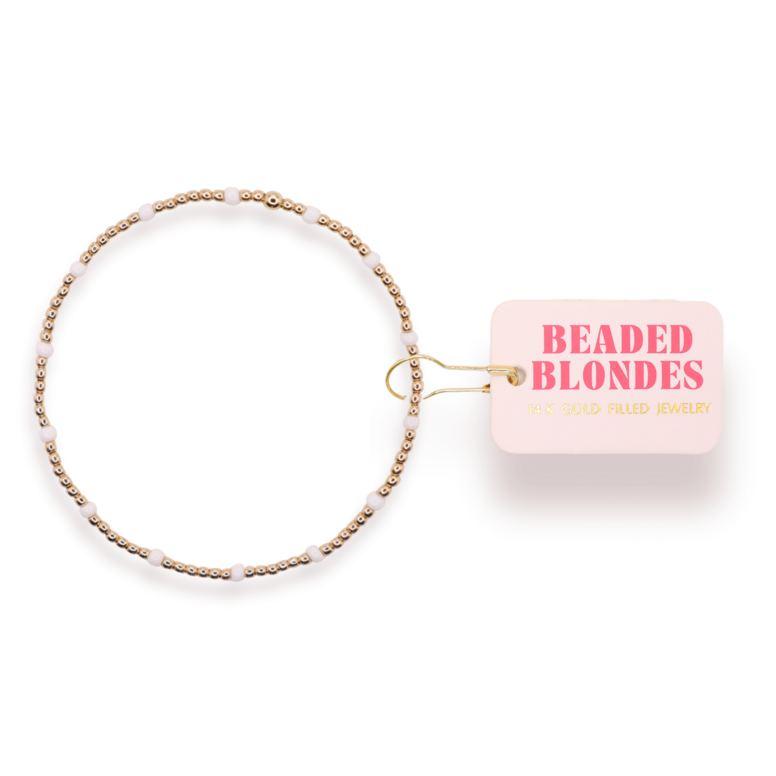 Beaded hair accessory with 'Beaded Blondes' packaging on a white background