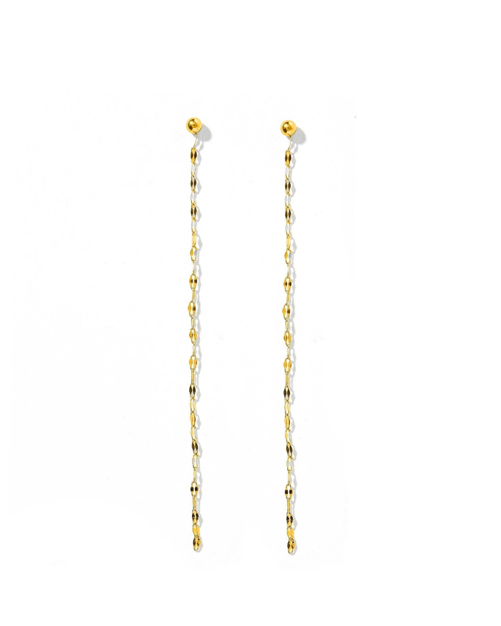 Gold chain earrings on a white background