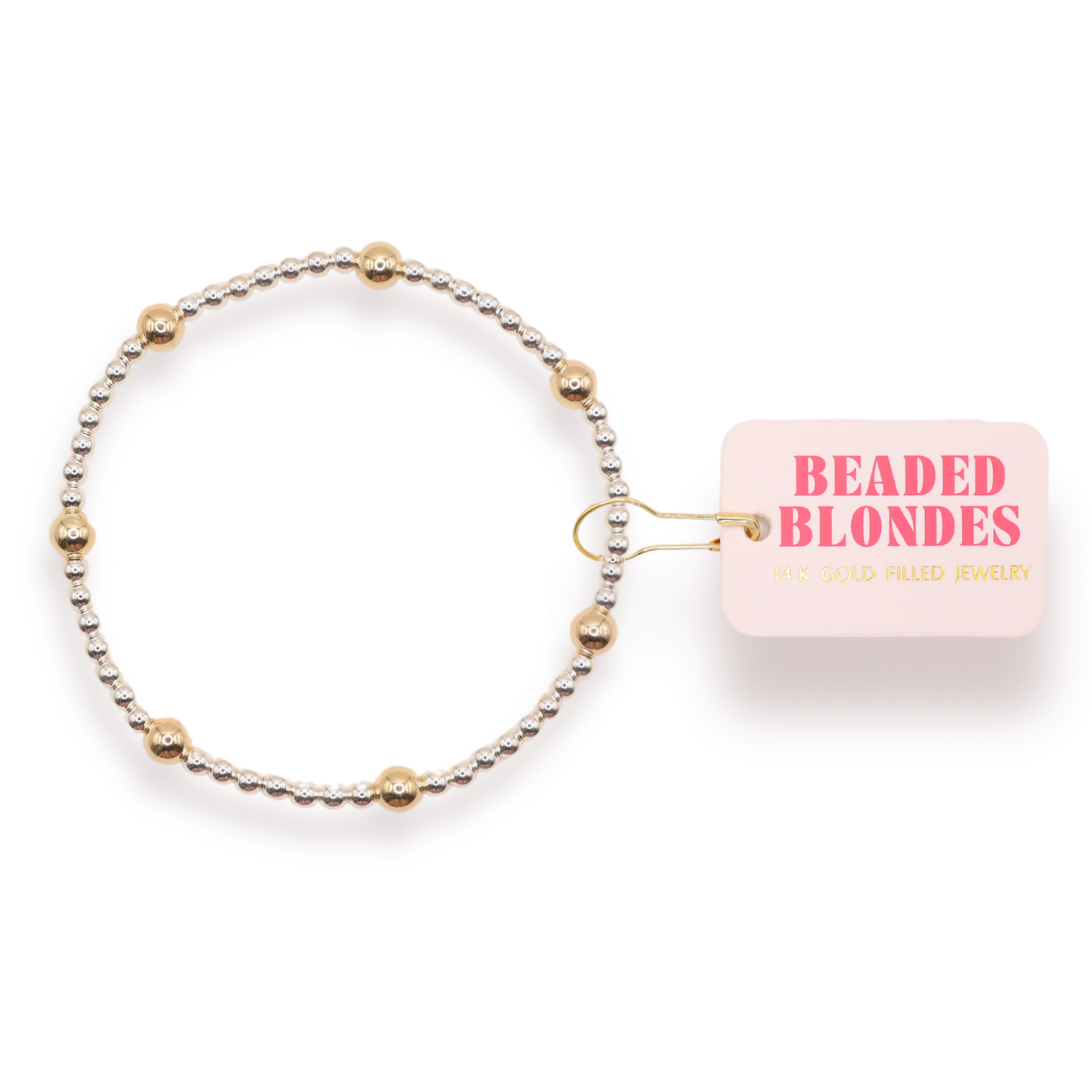 Beaded hair tie with 'Beaded Blondes' packaging on a white background