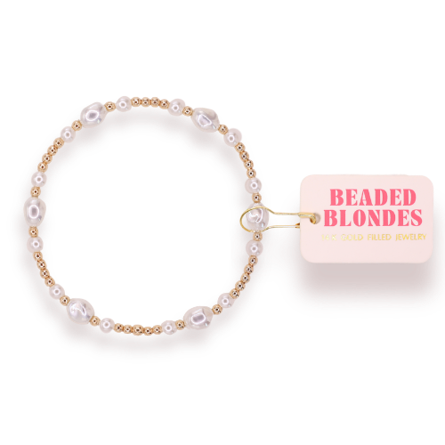 Pearl bracelet with 'Beaded Blondes' packaging on a white background
