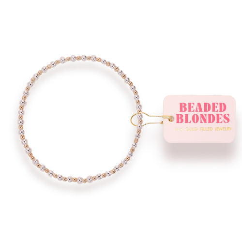 Beaded bracelet with 'Beaded Blondes' packaging on a white background
