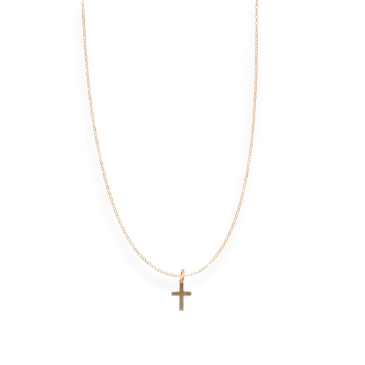 Gold necklace with a cross pendant on a white background