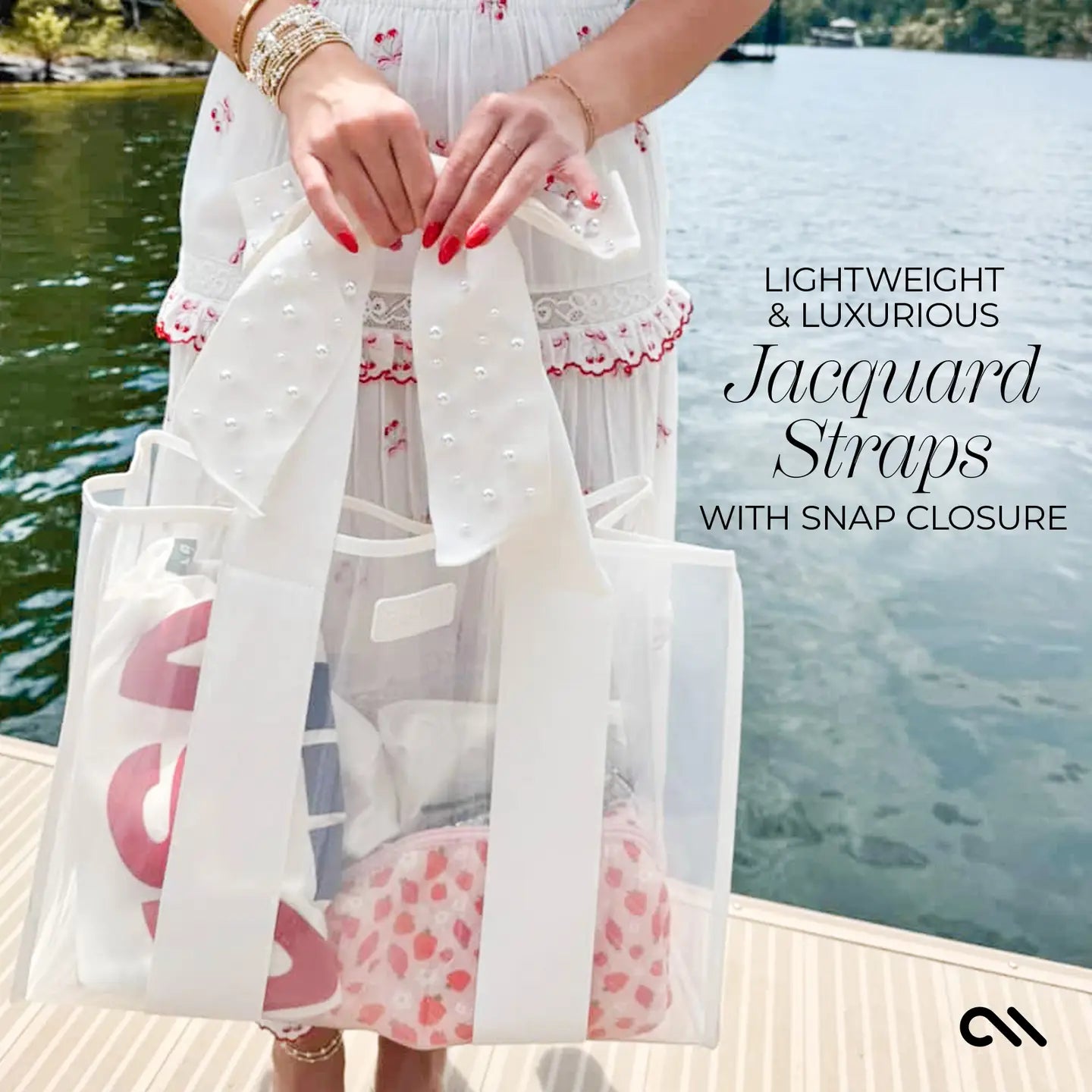 Person holding a white tote bag with pink heart design by a body of water, text about jacquard straps.