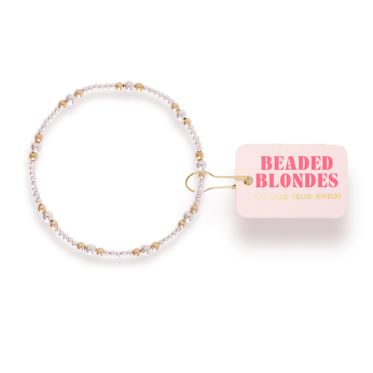 Beaded bracelet with 'Beaded Blondes' packaging on a white background