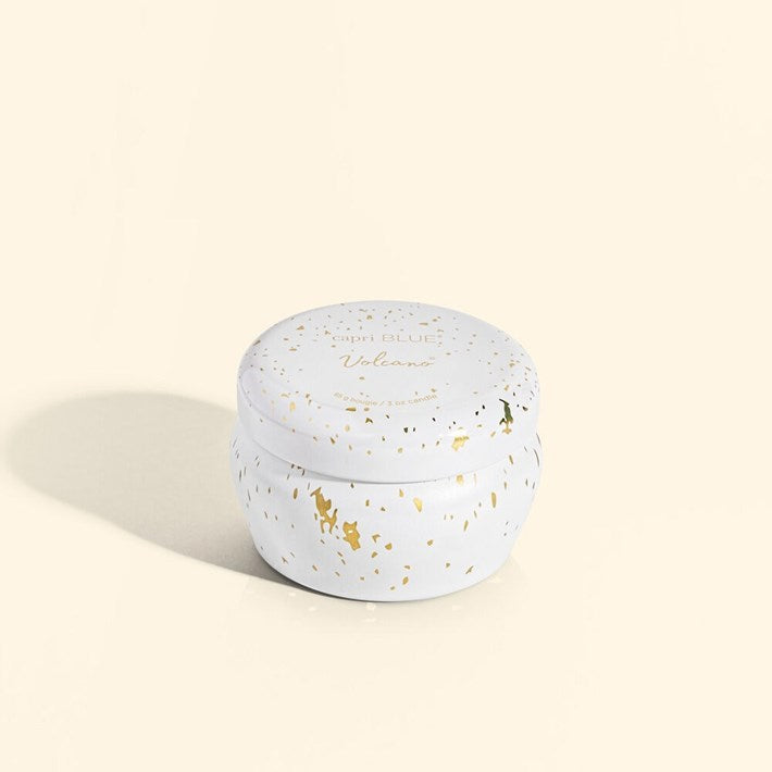 Round white container with gold speckles on a beige background