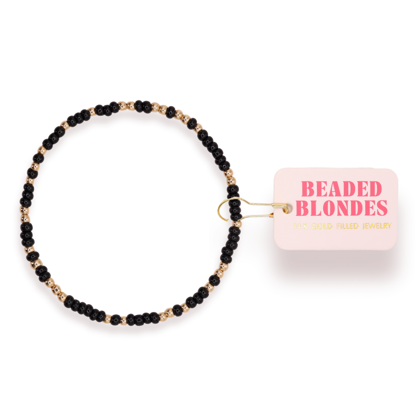 Black beaded bracelet with a pink container labeled 'Beaded Blondes' on a white background