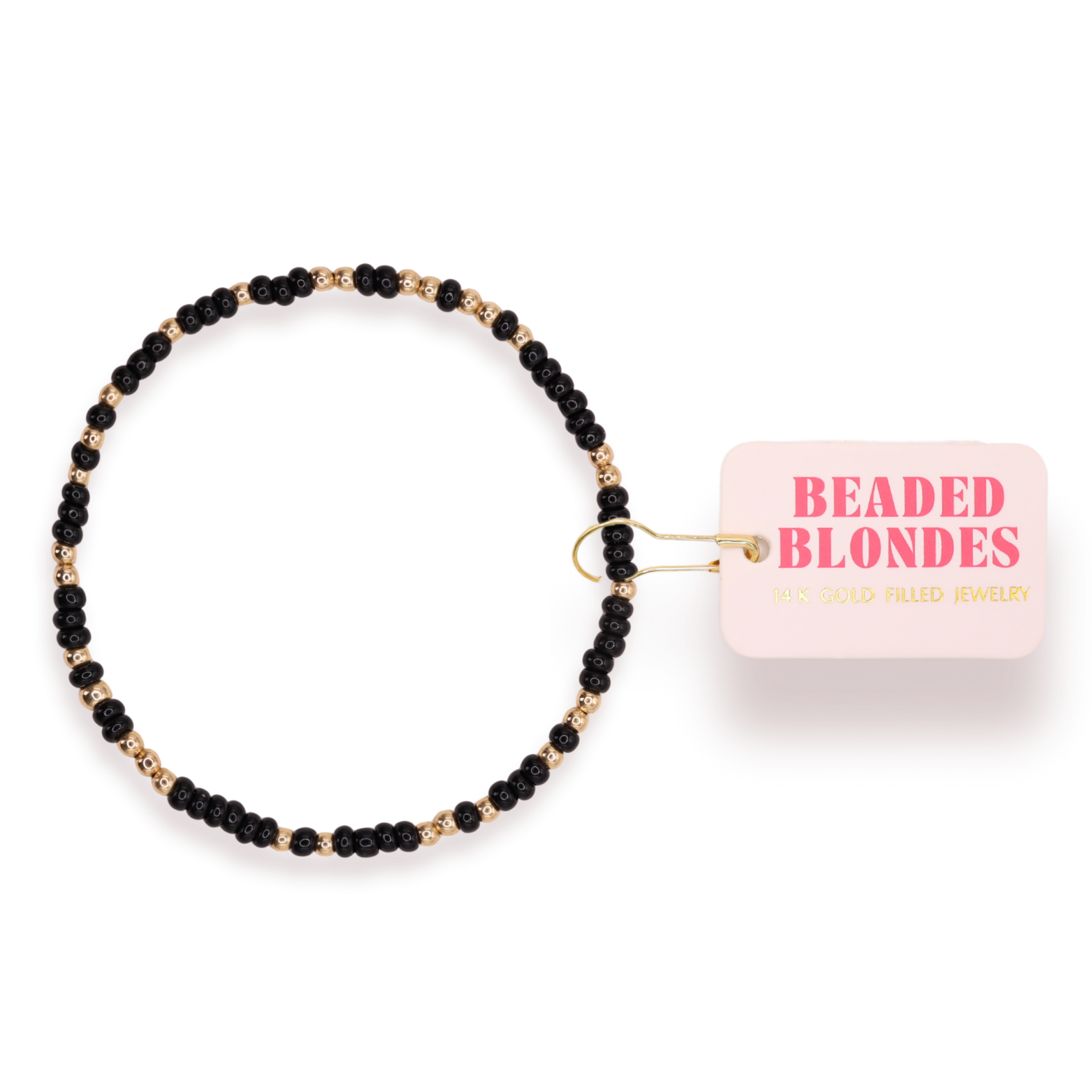 Black beaded bracelet with a pink container labeled 'Beaded Blondes' on a white background