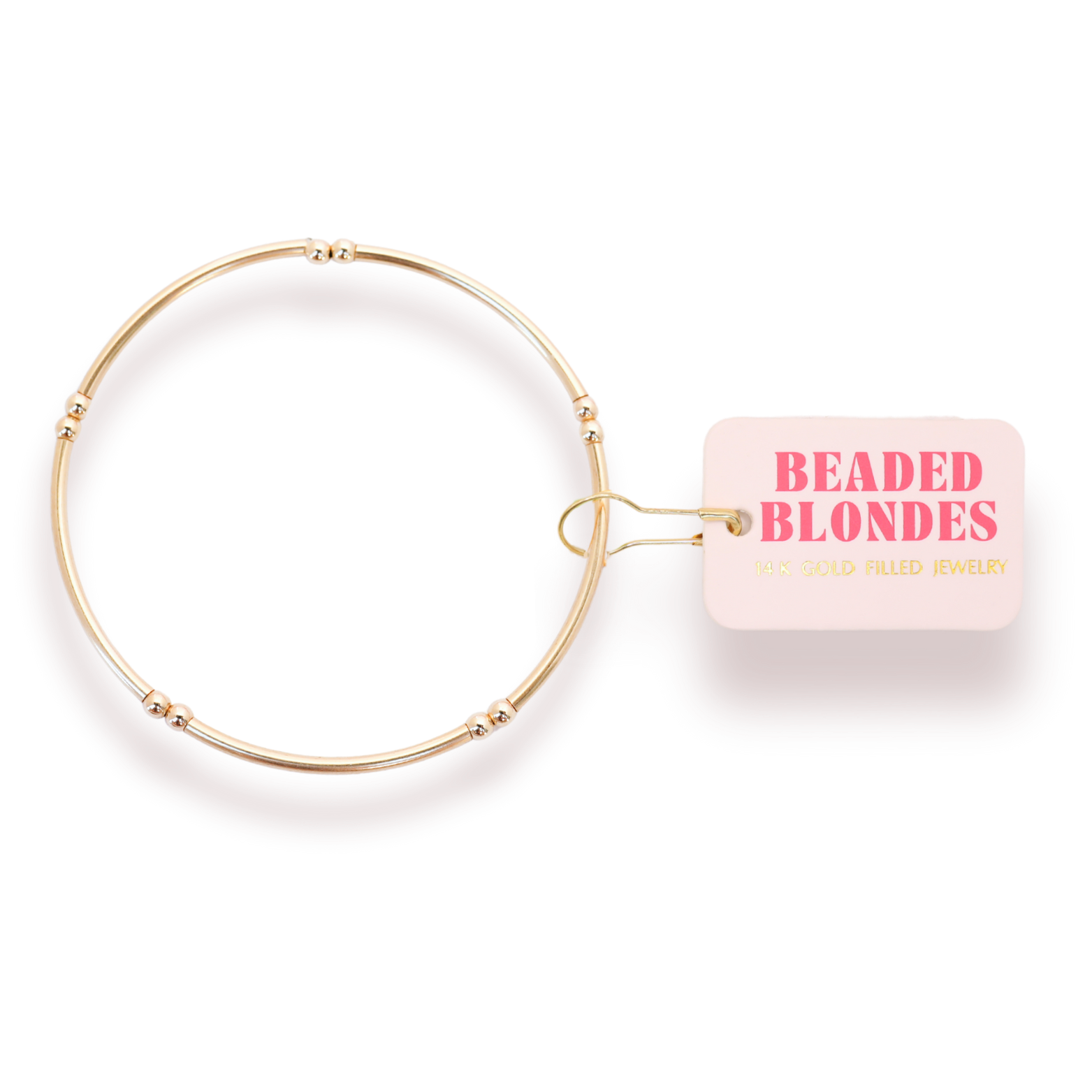 Gold beaded bracelet with 'Beaded Blondes' packaging on a white background