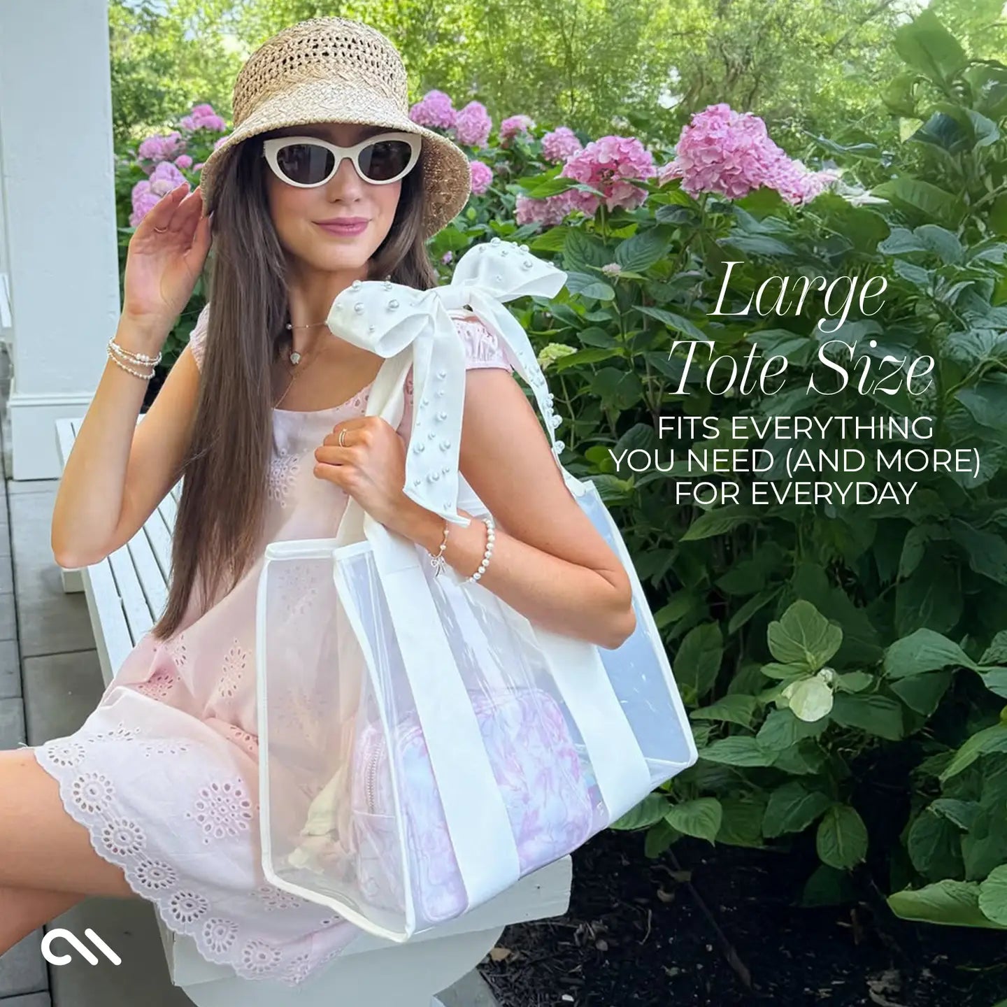 Woman holding a large tote bag outdoors with text about the tote's size and functionality.