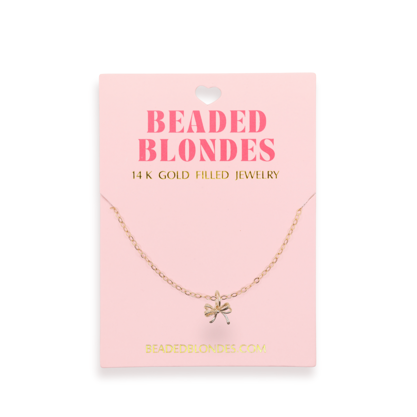 Gold necklace on a pink card with 'Beaded Blondes' branding