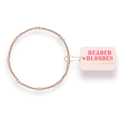 Beaded hair accessory with 'Beaded Blondes' label on a white background