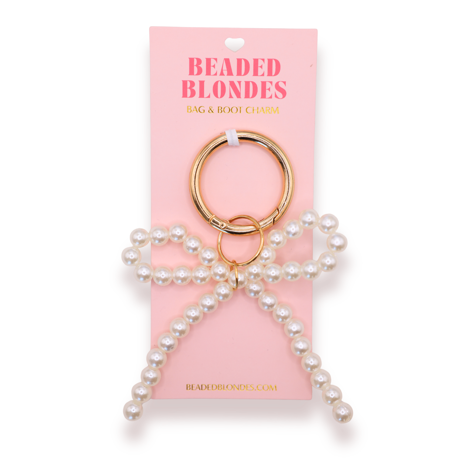 Pearl keychain on a pink 'Beaded Blondes' packaging with gold ring.