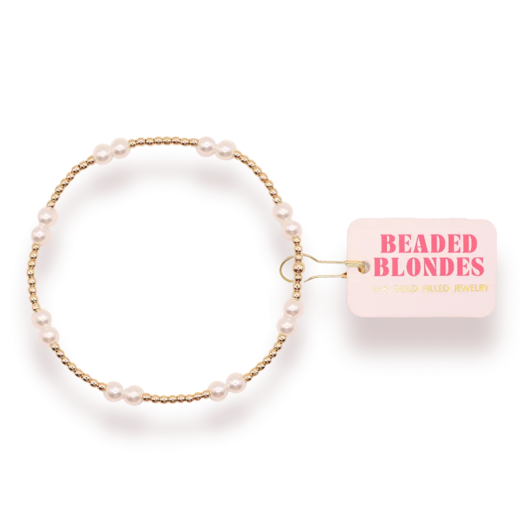 Pearl bracelet with gold accents on a white background, featuring 'Beaded Blondes' branding.