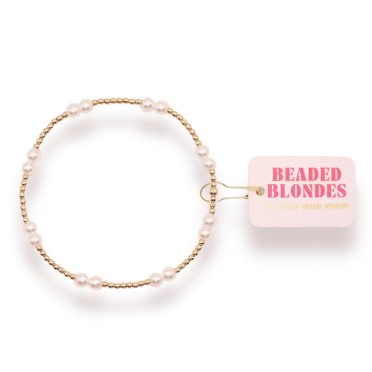 Pearl bracelet with gold accents on a white background, featuring 'Beaded Blondes' branding.