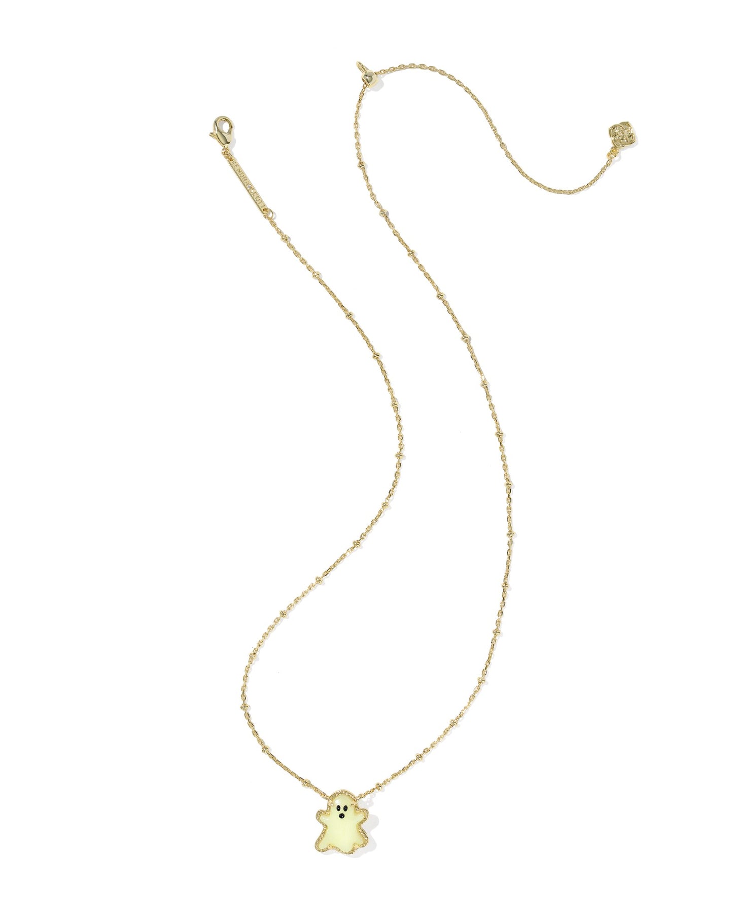 Gold necklace with glow in the dark ghost pendant on white background 