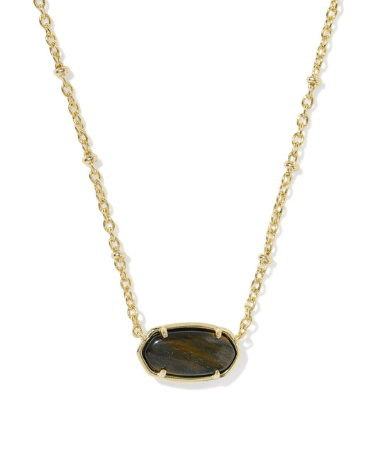 gold necklace with black pendant on a white background 