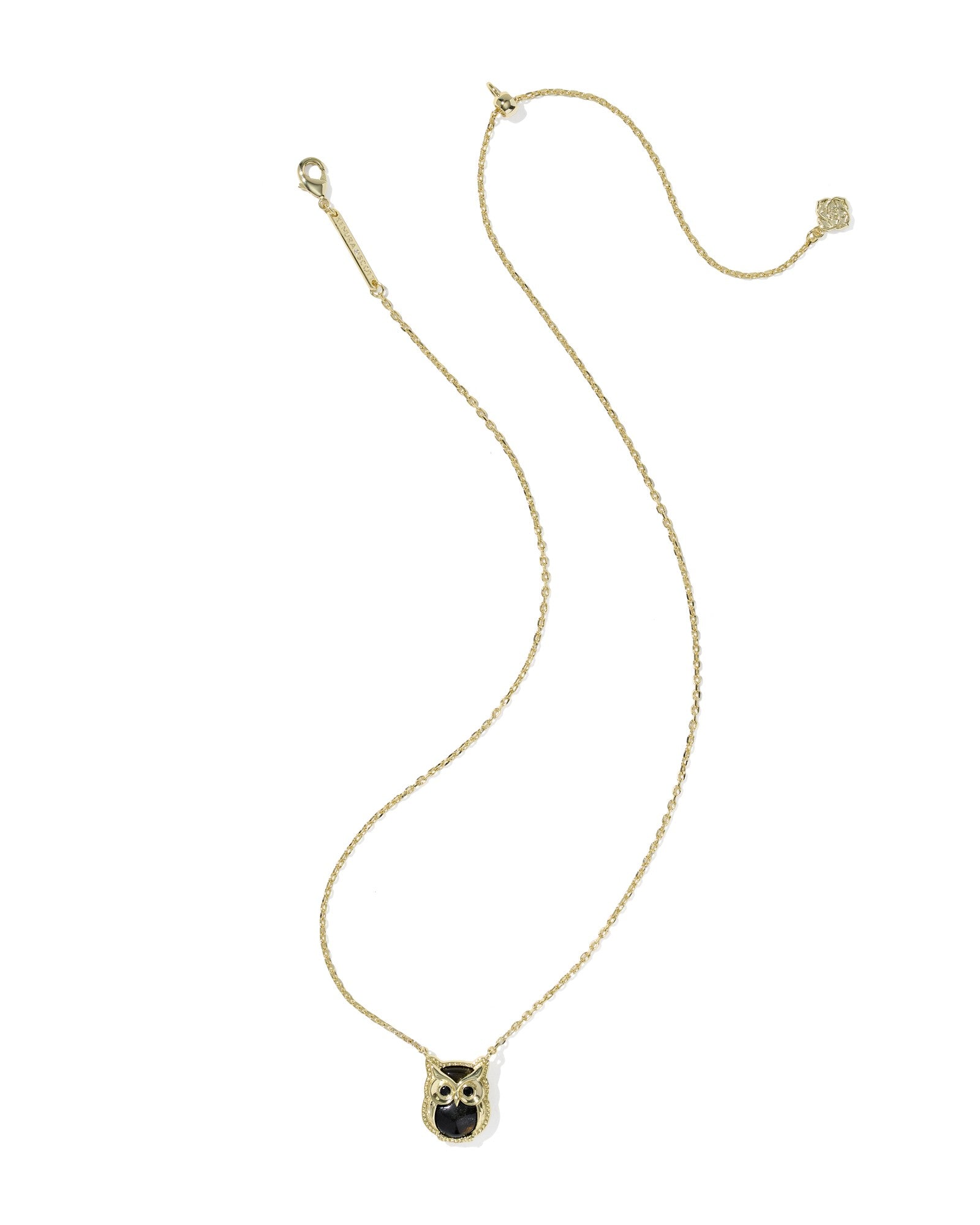 Gold necklace with a pendant on a white background