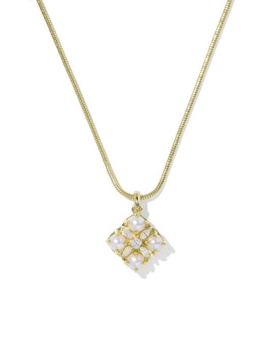 Gold necklace with a square pendant on a white background