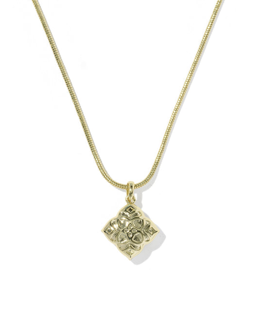 Gold necklace with a square pendant on a white background