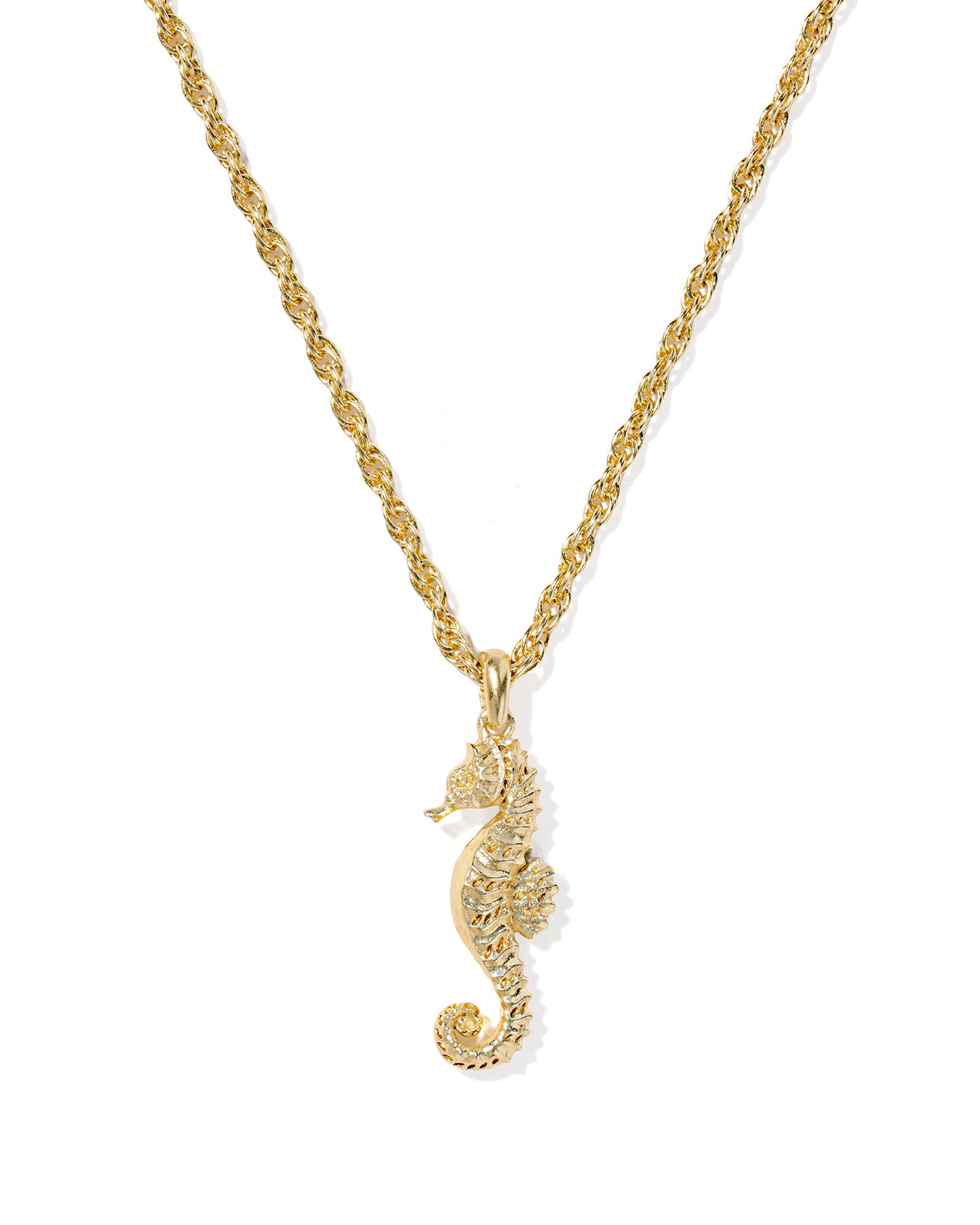 Gold seahorse pendant on a gold chain against a white background