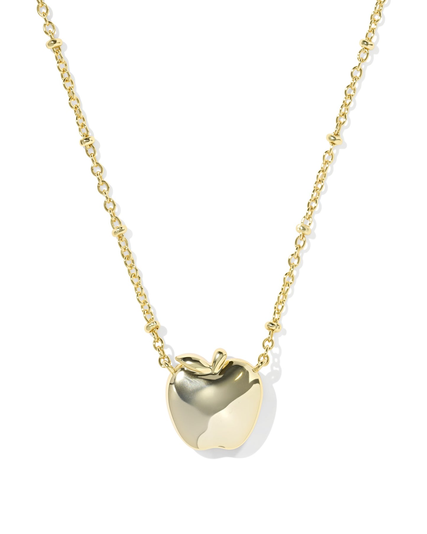 Kendra Scott gold apple pendant up close