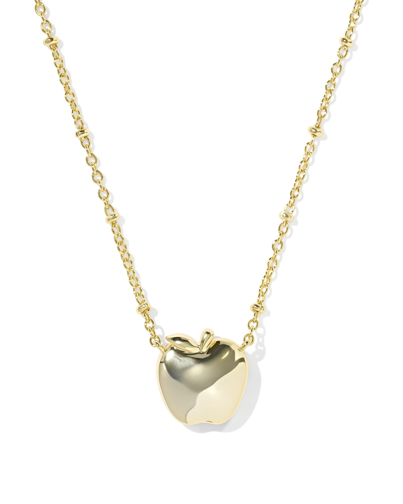 Kendra Scott gold apple pendant up close
