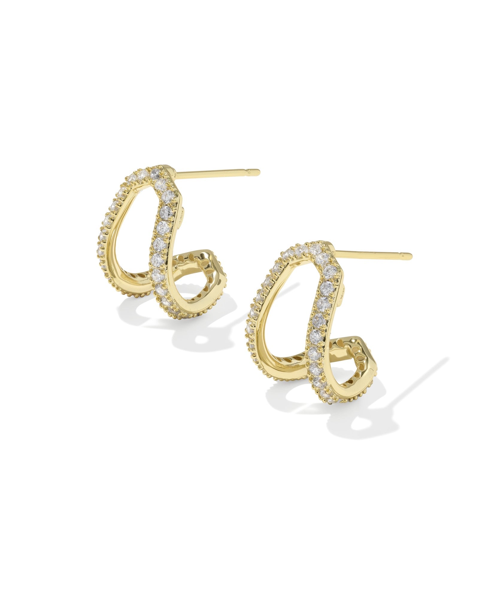 Gold spiral earrings with embedded stones on a white background