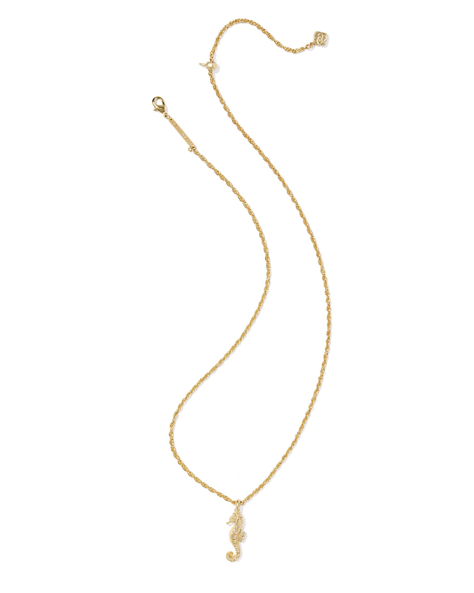 Gold necklace with a seahorse pendant on a white background