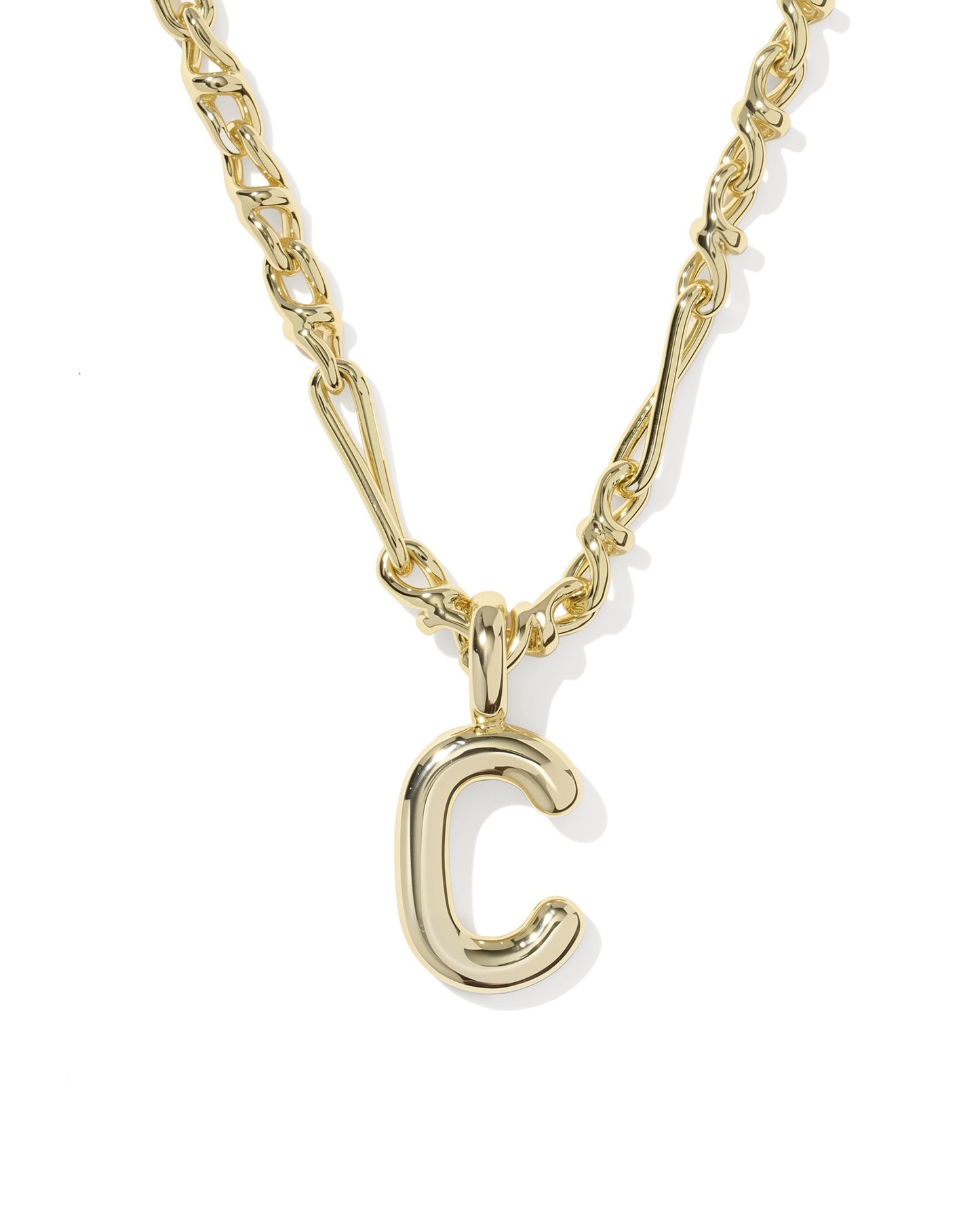Gold necklace with a 'C' pendant on a white background