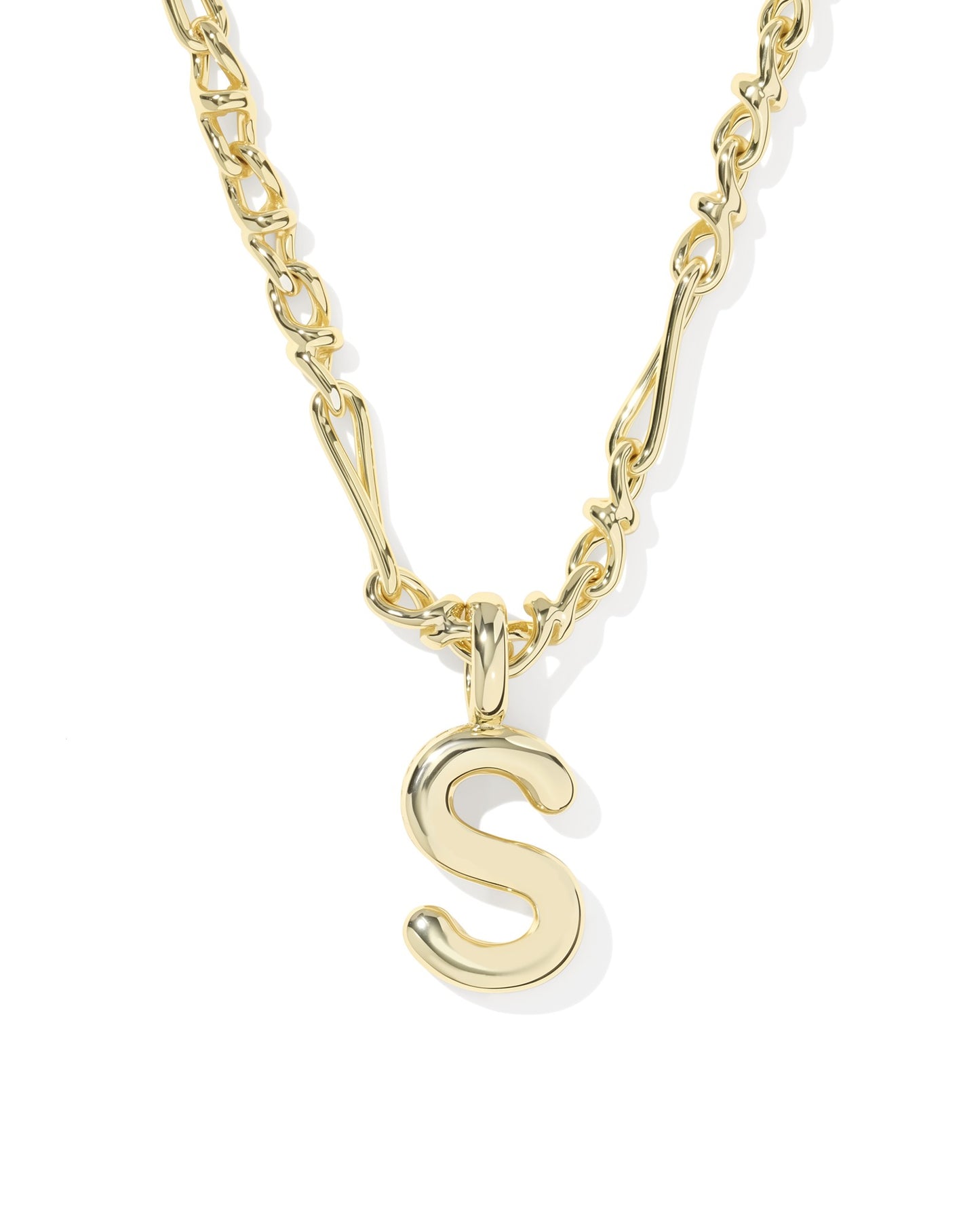 Gold necklace with a 'S' pendant on a white background