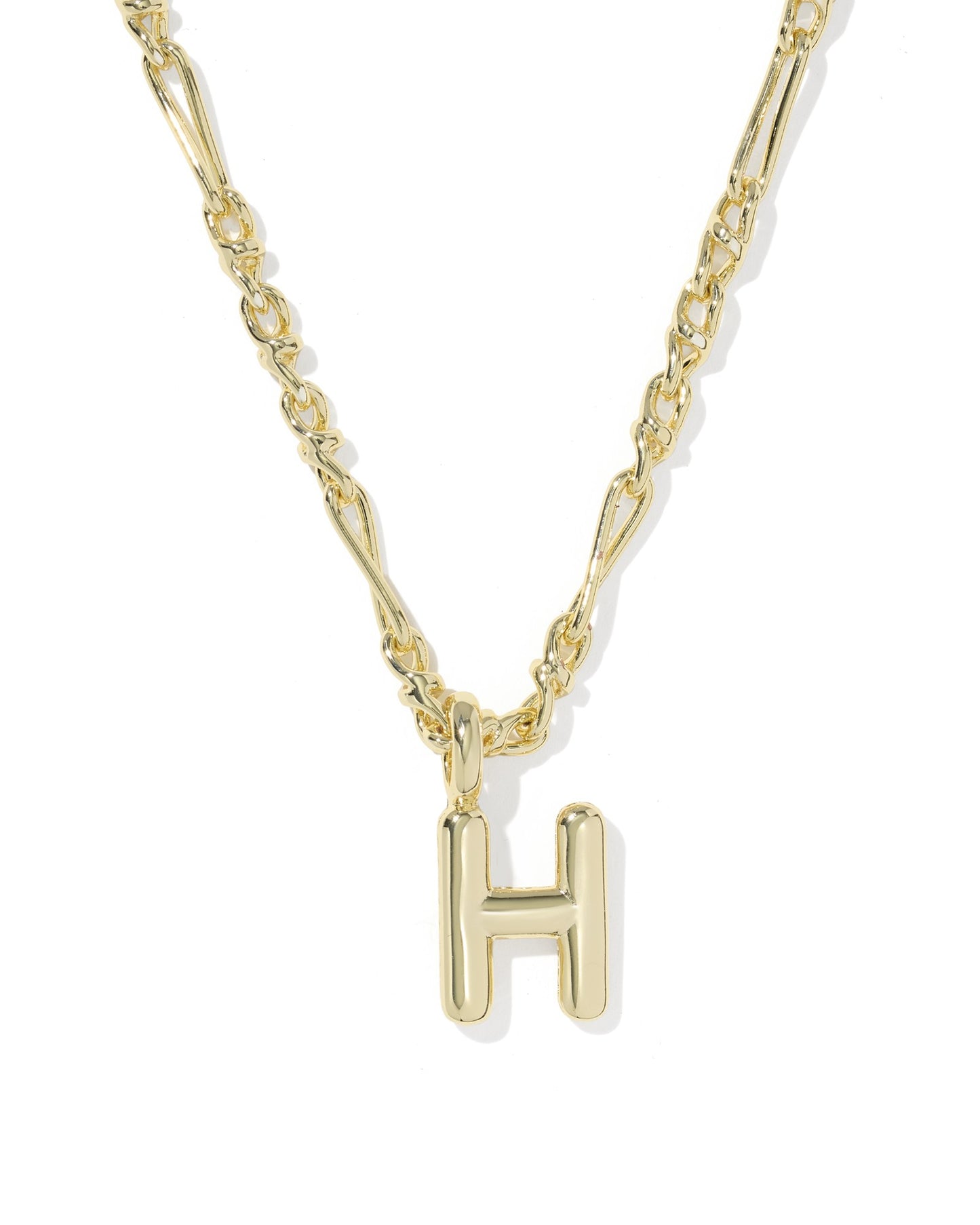 Gold necklace with a 'H' pendant on a white background