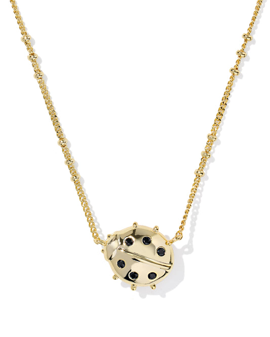 Gold necklace with a ladybug pendant on a white background